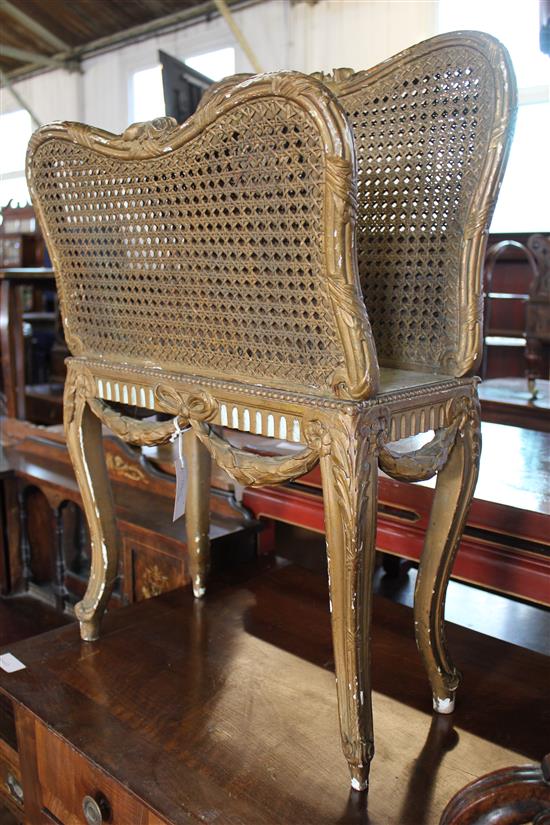 Early 20th century caned giltwood magazine rack(-)